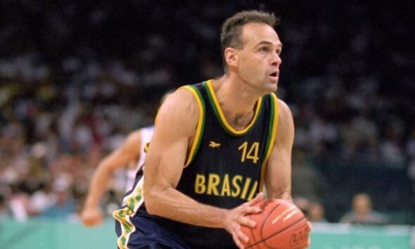 Basketball player in Brazil jersey  dribbling the ball during a game on the court