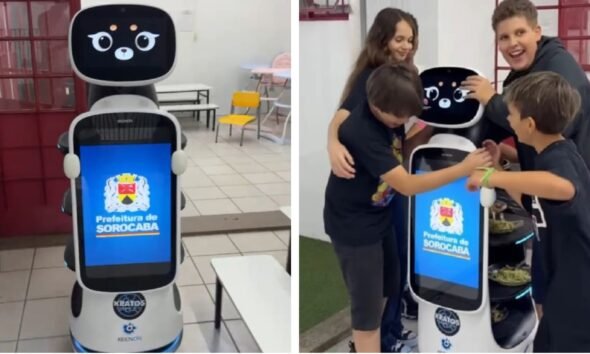 Robot Kratos with touchscreen displaying Prefeitura de Sorocaba logo standing in a classroom setting