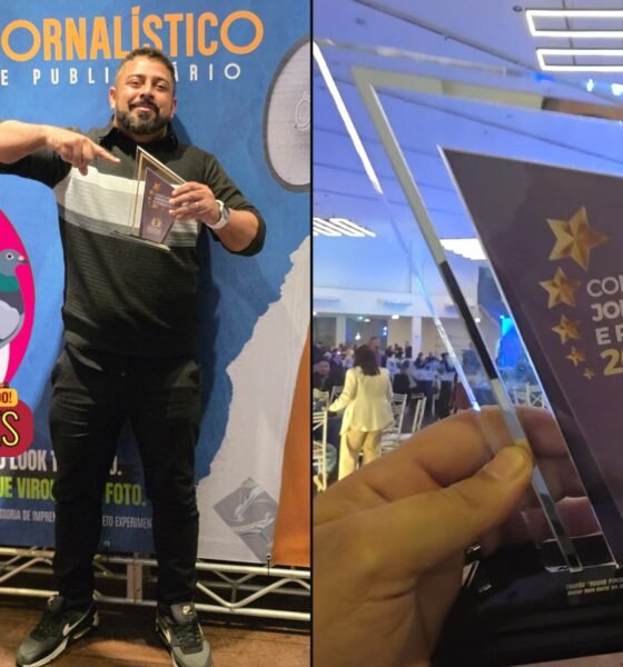 Man posing with a glass trophy in front of a blue event banner that reads Concurso Jornalístico e Publicitário with a large colorful logo and pigeons left panel of a split photo
