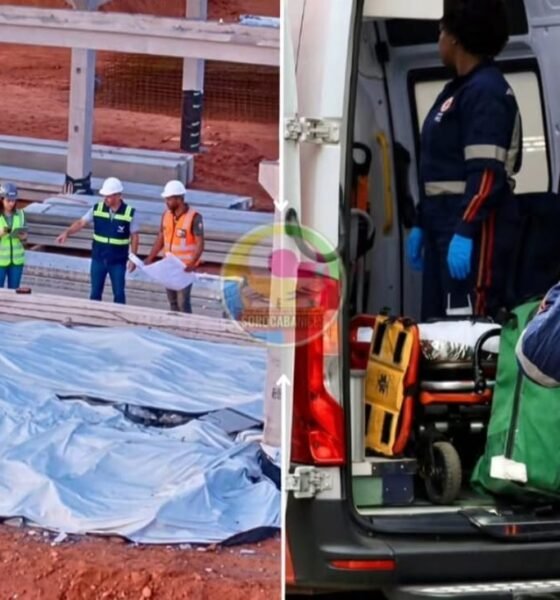 Construction site scene with workers examining a collapsed blue tarp and metal framework nearby safety gear visible helmets vests
